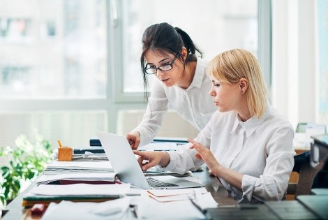 Two Women Working